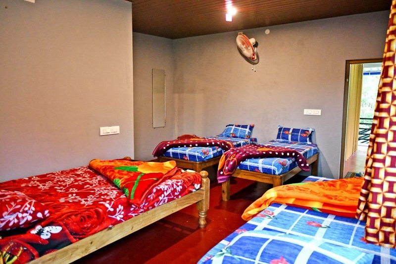 Guest room with beds and balcony access