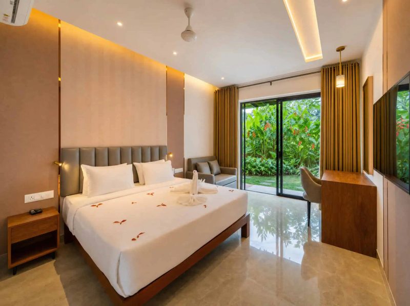 Vega Delight Cottage interior with king bed and garden patio access