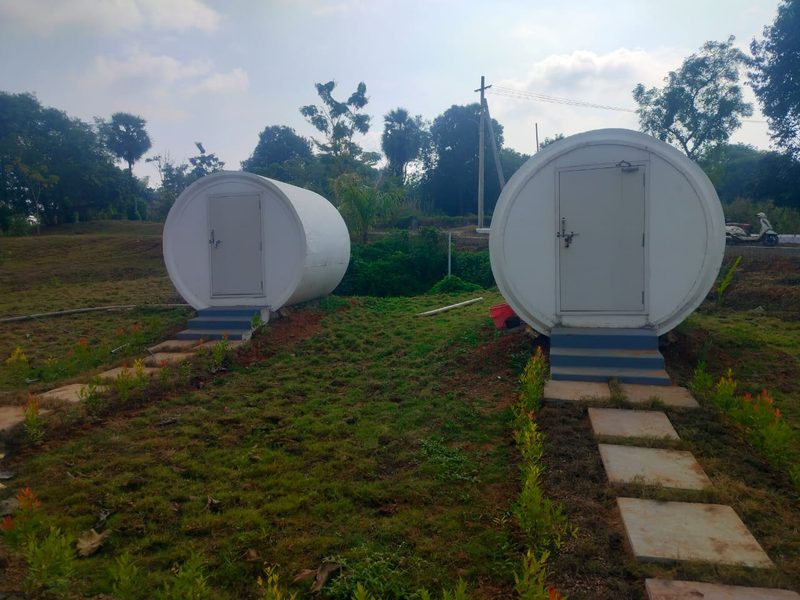 Capsule pod cabins on a grassy slope